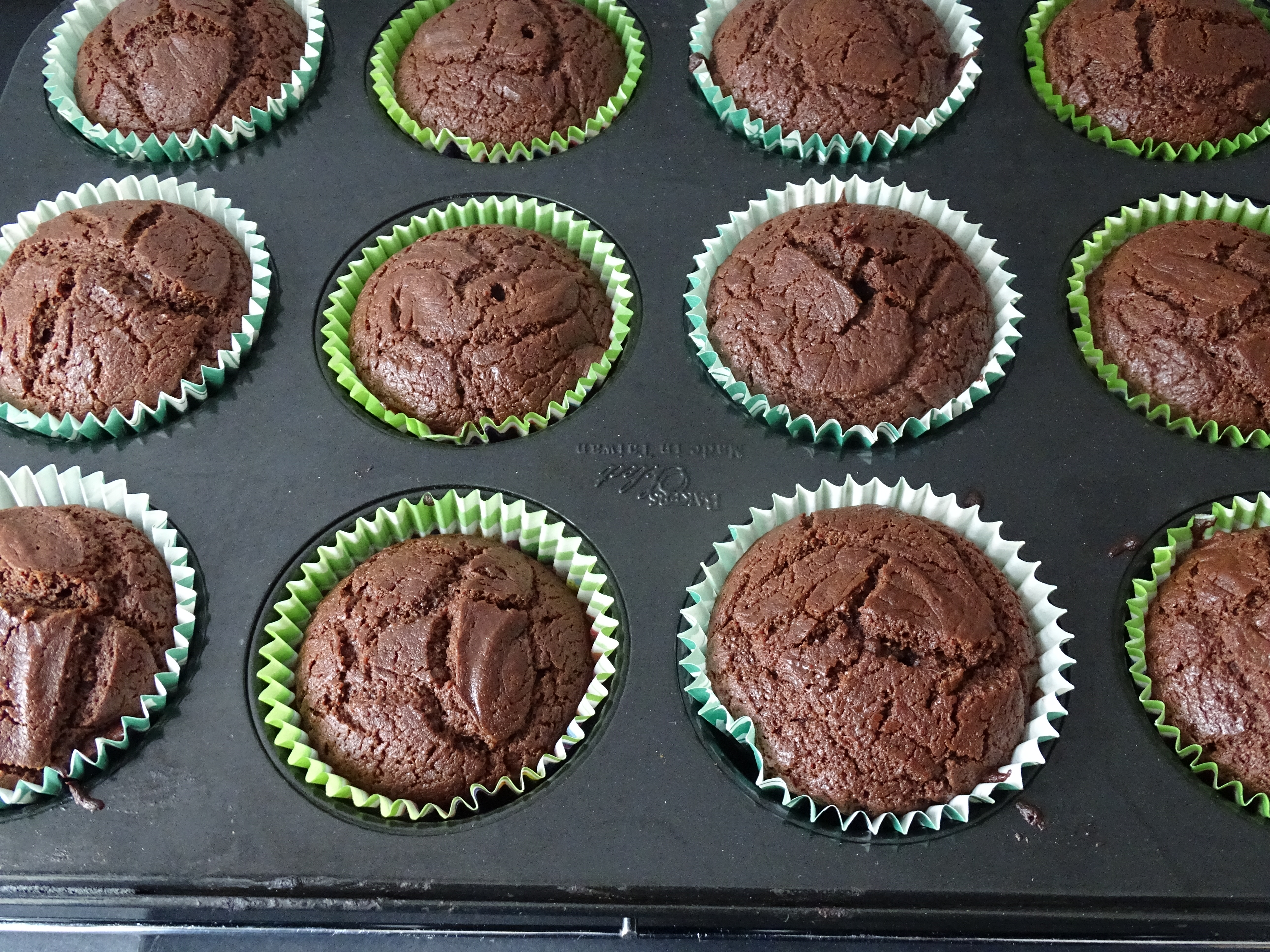Baking tray of chocolate muffins